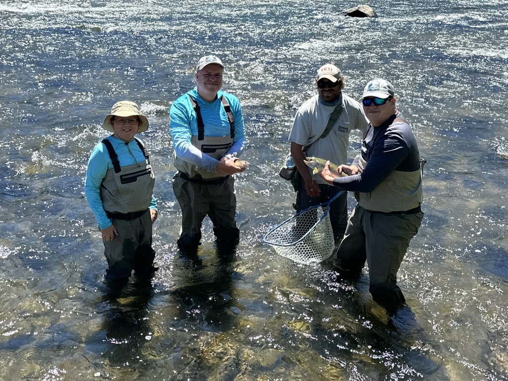 Tony fly fishing in a mountain river enjoying his Fun Money outdoor adventure